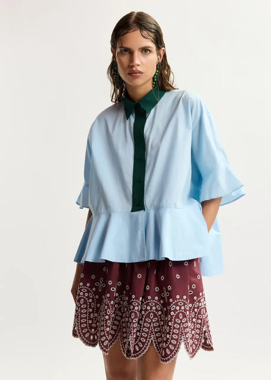 Light blue cotton peplum shirt with dark green contrast detailing