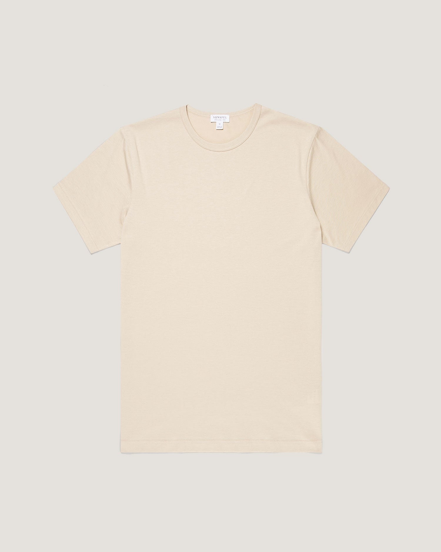 Beige t-shirt on a light gray background