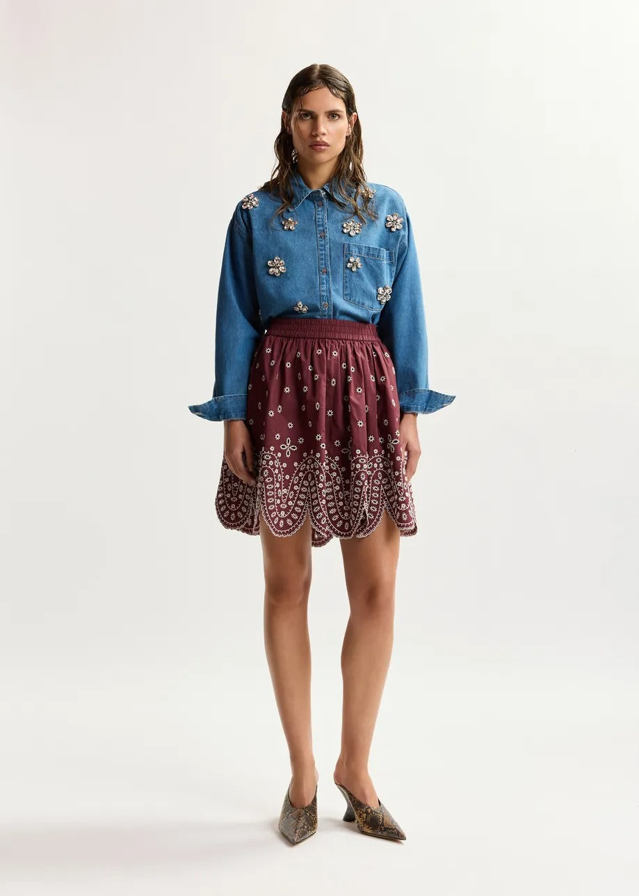 Dark red and white embroidered cotton skirt with scalloped hemline
