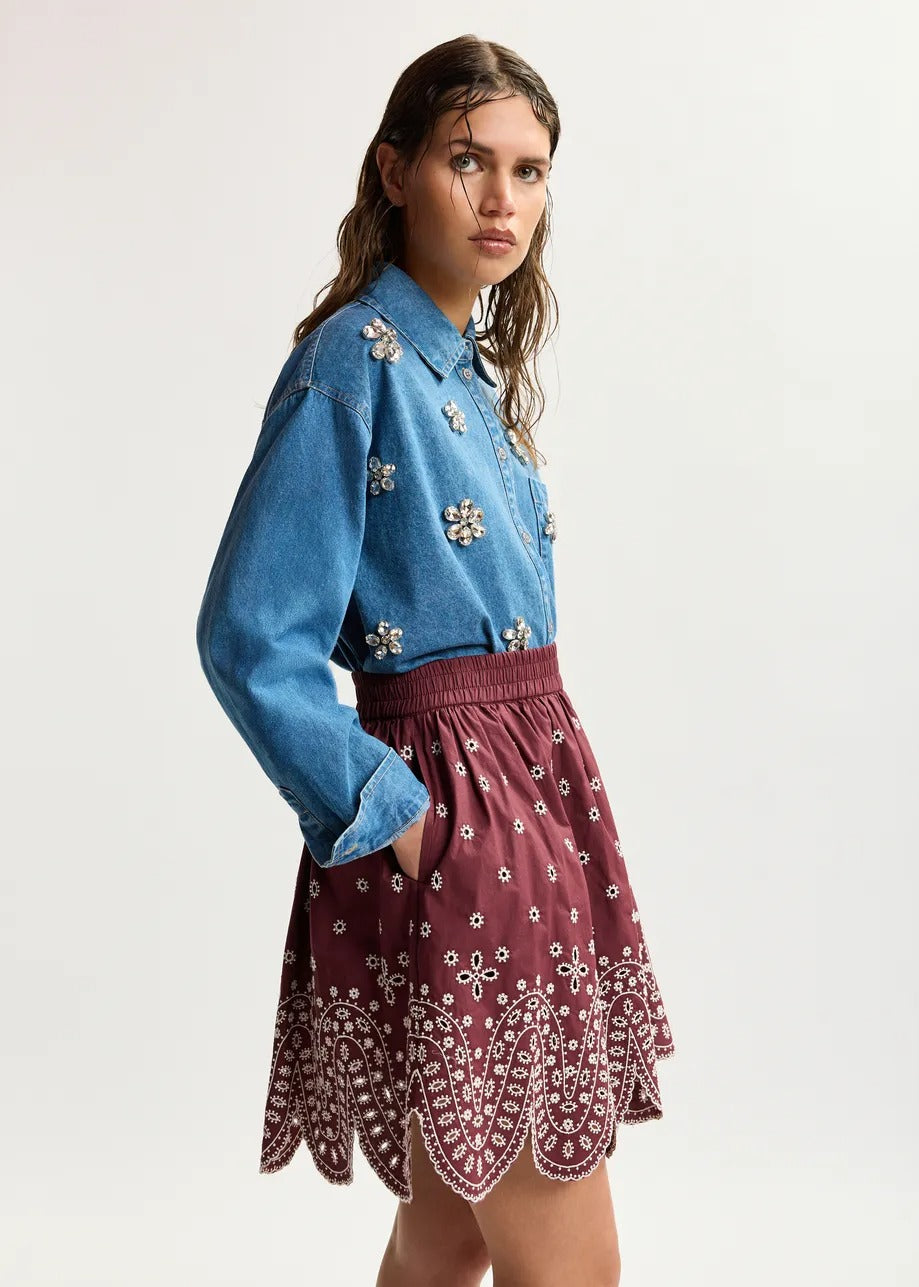 Dark red and white embroidered cotton skirt with scalloped hemline
