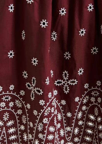 Dark red and white embroidered cotton skirt with scalloped hemline
