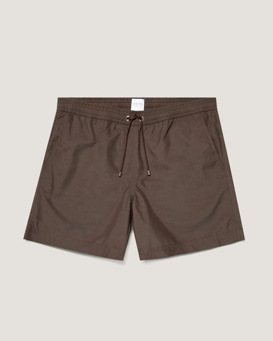 Brown shorts with a drawstring on a light beige background