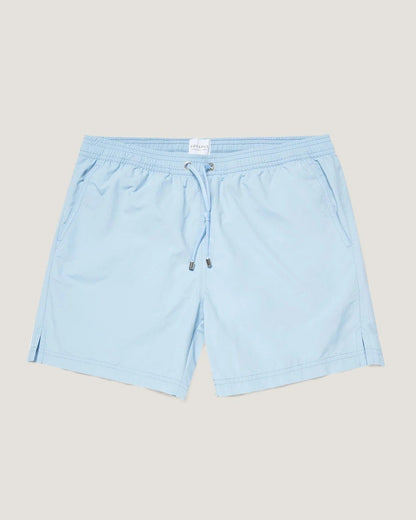 Light blue shorts on a beige background