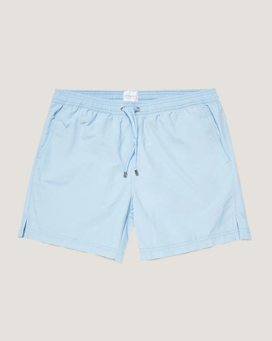 Light blue shorts on a beige background