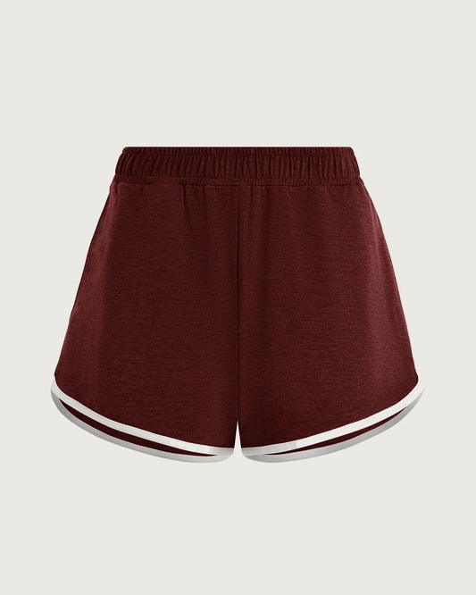 Maroon shorts with white trim on a light gray background
