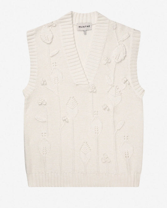 White knitted vest with textured pattern on a white background