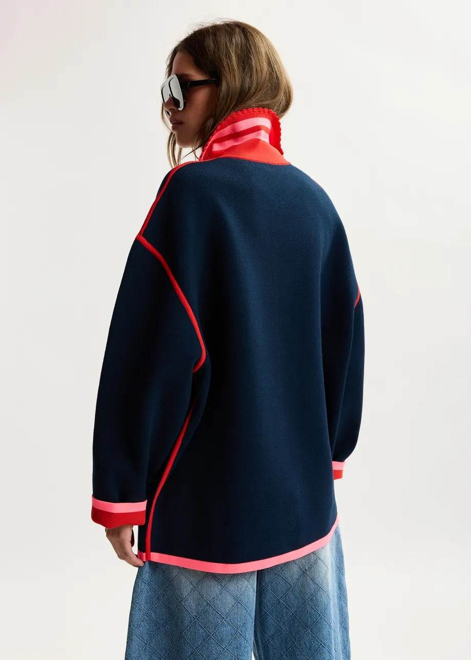 Navy, red and pink fine knit cardigan with lace-trimmed collar and strawberry-shaped buttons
