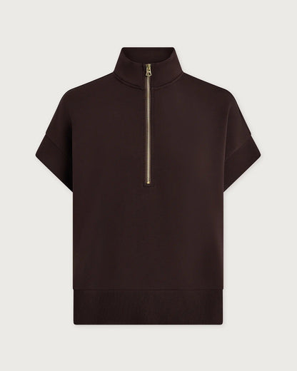 Brown Varley short-sleeve top with a gold zipper on a light gray background