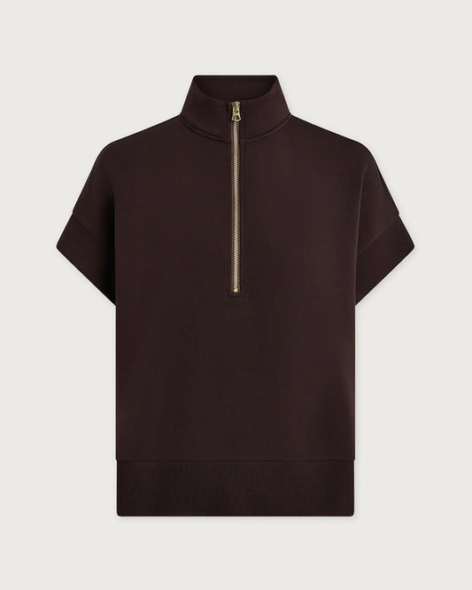 Brown Varley short-sleeve top with a gold zipper on a light gray background