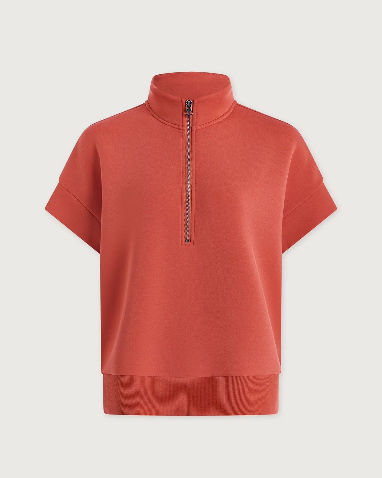 Red short-sleeve pullover with a quarter zip on a light gray background