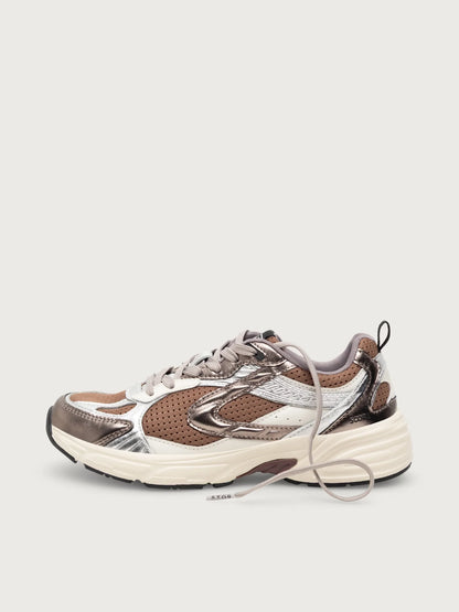 A low-top chunky sneaker in metallic bronze, silver, and brown mesh with a thick off-white sole, shown from a side profile on a light gray background.