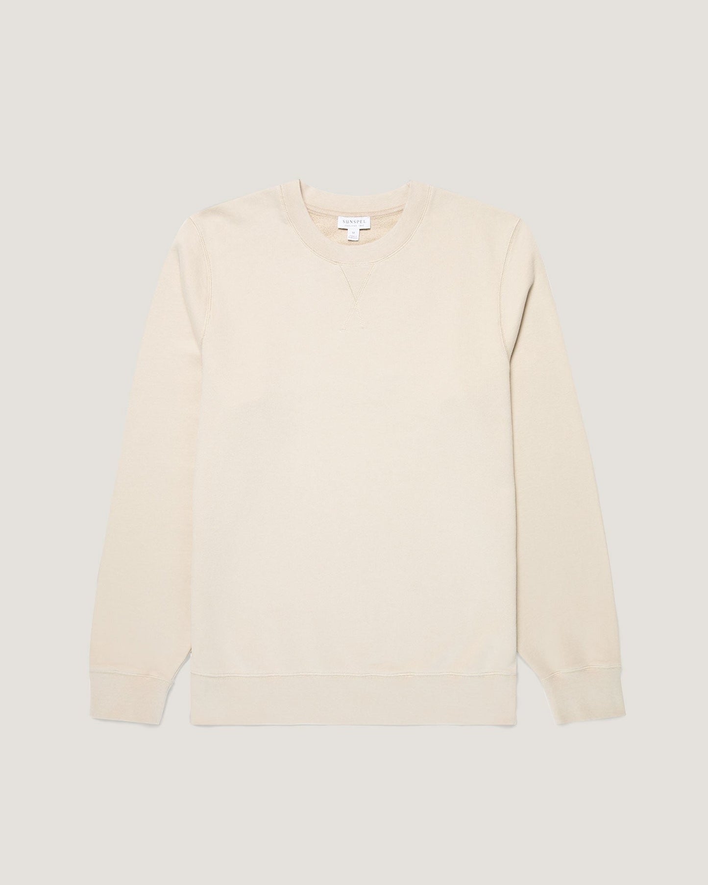 Beige sweater on a light gray background