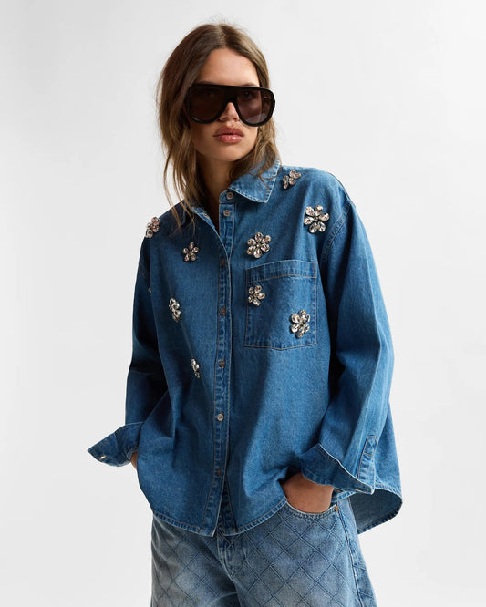 Blue denim shirt with floral rhinestone embellishments from essentiel antwerp